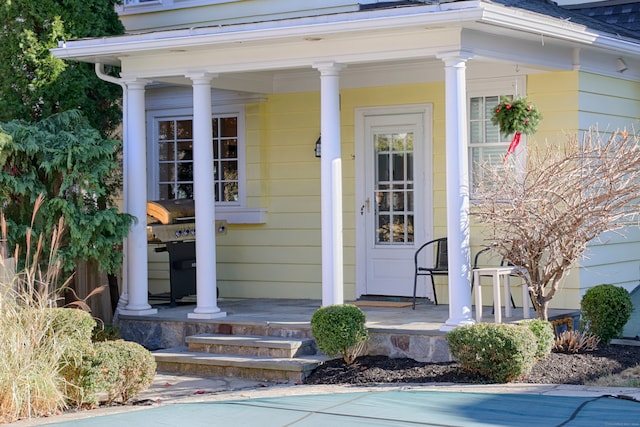 doorway to property featuring a porch