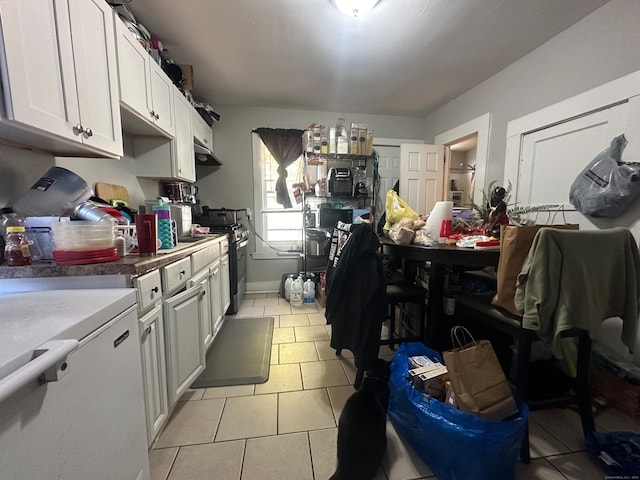 666 Orchard St, New Haven, CT 06511 - kitchen featuring white cabinets, white fridge, gas stove, and light tile patterned floors