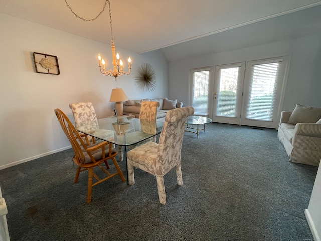 dining area with dark colored carpet, lofted ceiling, and a chandelier