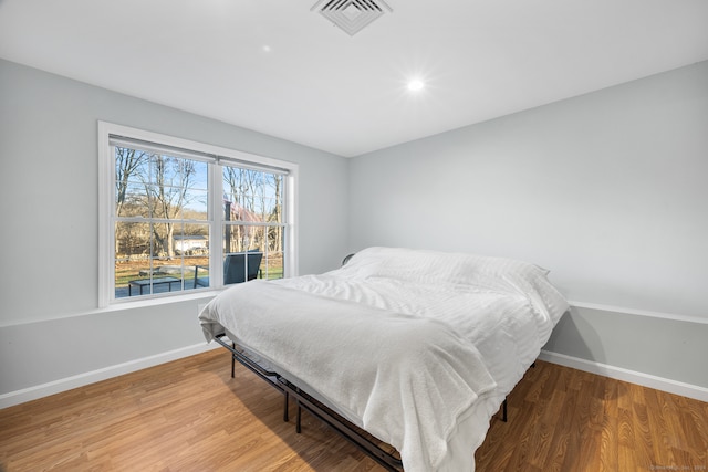 bedroom featuring hardwood / wood-style flooring