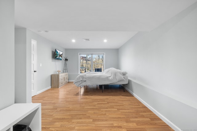 bedroom featuring light hardwood / wood-style floors