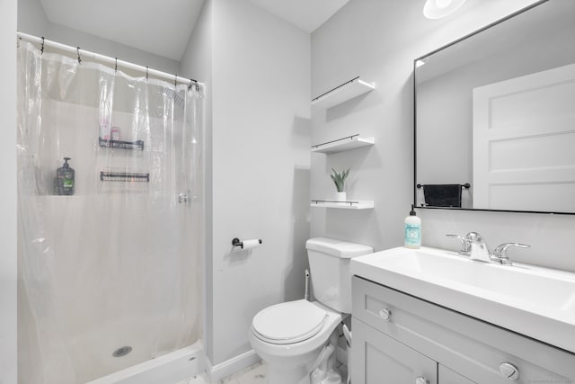 bathroom with vanity, toilet, and walk in shower