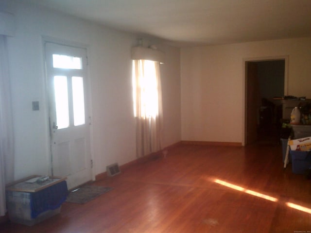 entryway with hardwood / wood-style floors