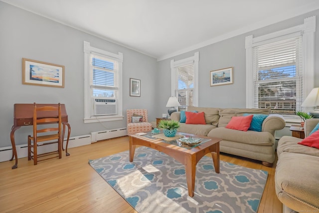 living room with crown molding, cooling unit, and light wood-type flooring