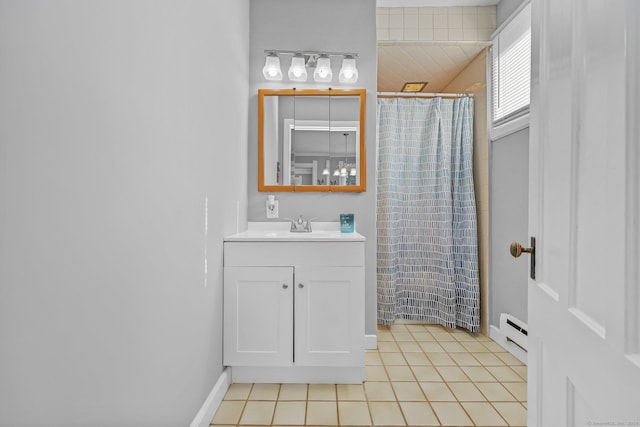 bathroom with tile patterned flooring, vanity, curtained shower, and a baseboard radiator