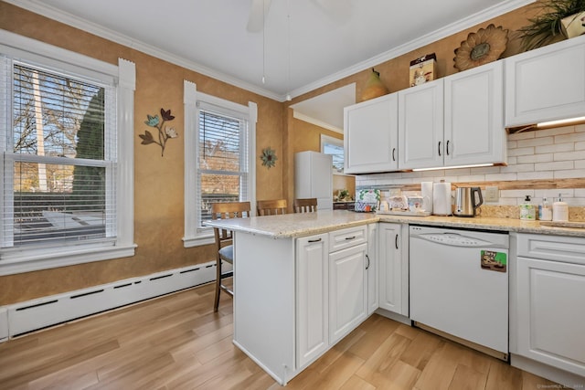 kitchen featuring kitchen peninsula, white cabinetry, and white dishwasher