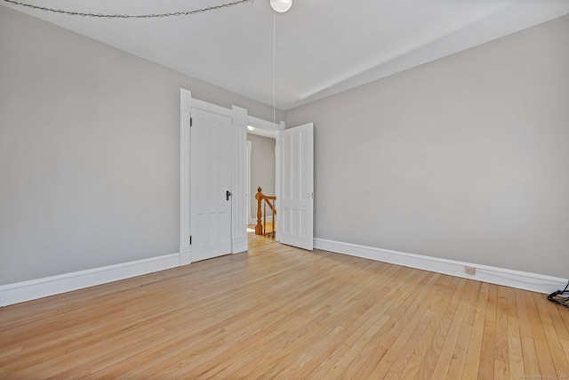 unfurnished room featuring light hardwood / wood-style floors