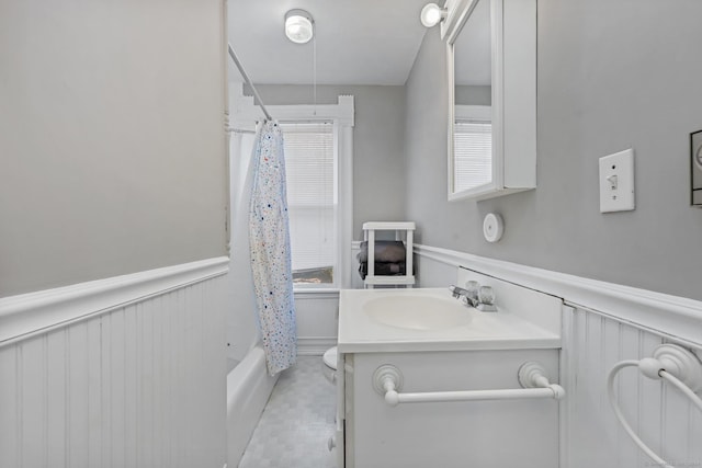 bathroom with tile patterned flooring, vanity, and shower / bath combo