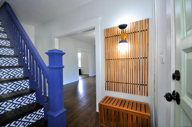 stairs with hardwood / wood-style floors