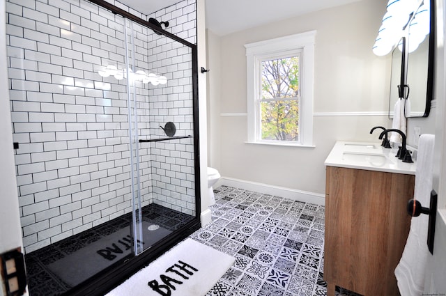 bathroom featuring tile patterned floors, vanity, toilet, and an enclosed shower