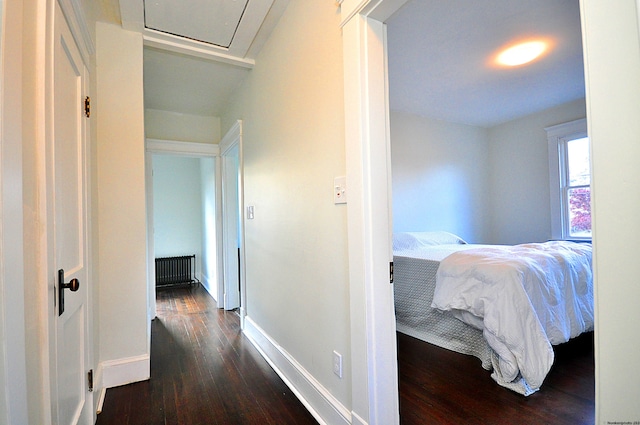 corridor featuring dark hardwood / wood-style floors