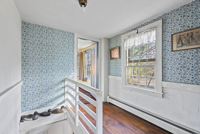 interior space featuring hardwood / wood-style flooring and a baseboard heating unit