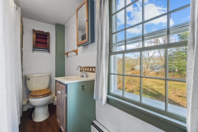 bathroom featuring hardwood / wood-style flooring, vanity, and toilet