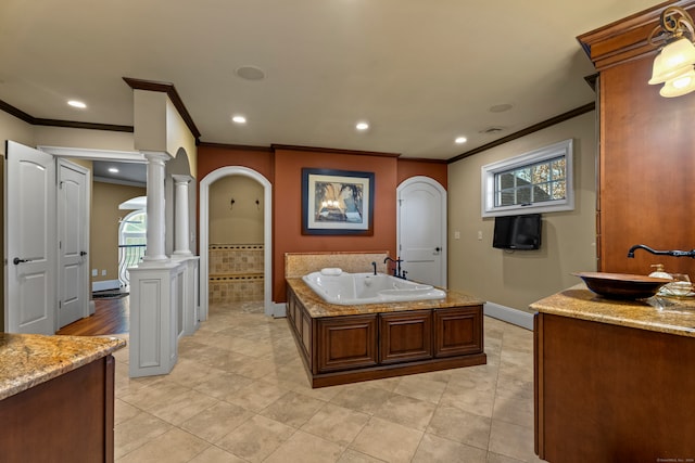 bathroom featuring decorative columns, tile patterned flooring, vanity, and ornamental molding