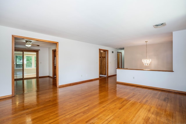 45 Wentworth Dr, East Hartford, CT 06118 - unfurnished room featuring a chandelier and light wood-style flooring