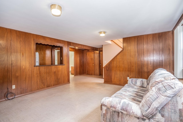 45 Wentworth Dr, East Hartford, CT 06118 - living area featuring wooden walls, tile patterned floors, and stairway