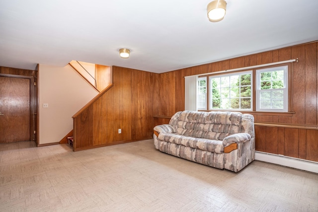 45 Wentworth Dr, East Hartford, CT 06118 - living room featuring wood walls, stairs, and baseboard heating