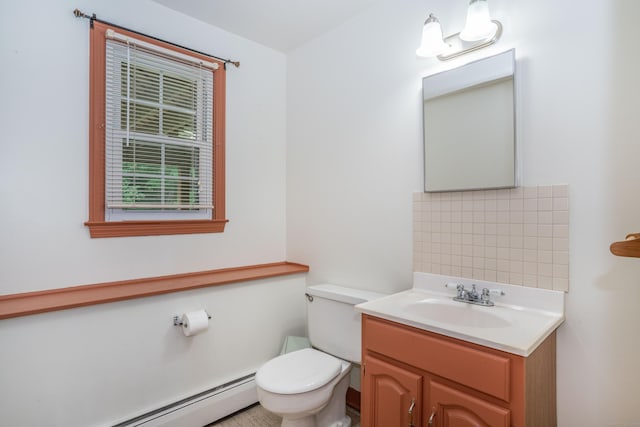 45 Wentworth Dr, East Hartford, CT 06118 - half bath featuring a baseboard radiator, vanity, and decorative backsplash