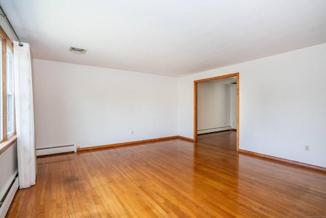 45 Wentworth Dr, East Hartford, CT 06118 - unfurnished room with a baseboard radiator and light wood-type flooring