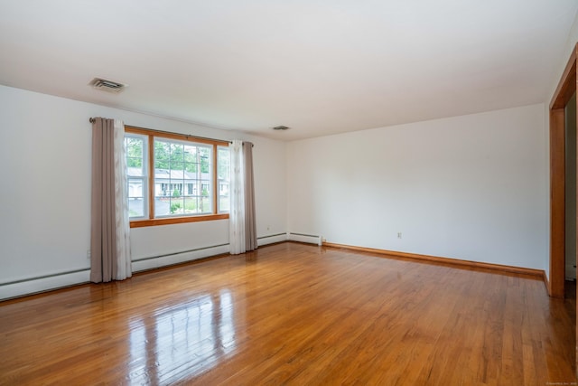 45 Wentworth Dr, East Hartford, CT 06118 - unfurnished room with light wood-style flooring, baseboard heating, and a baseboard heating unit