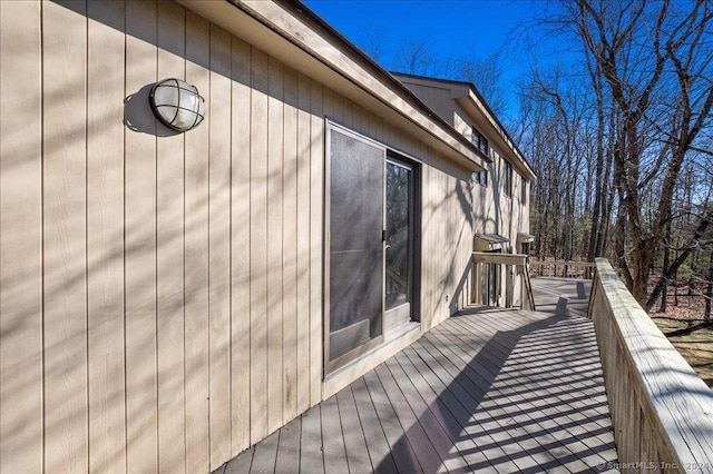 view of home's exterior featuring a wooden deck