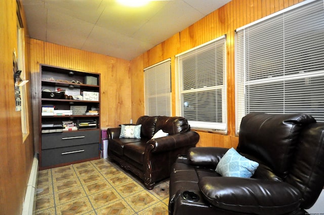 living room featuring tile patterned flooring and wooden walls