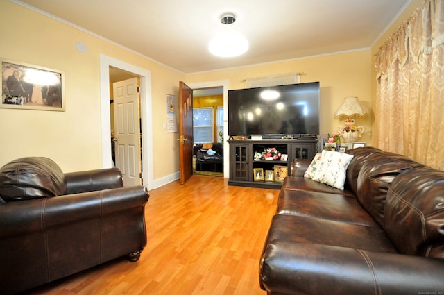 living room with hardwood / wood-style floors and crown molding