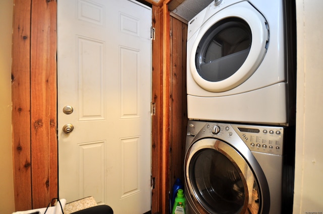 laundry area featuring stacked washer and clothes dryer