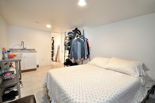 tiled bedroom with sink