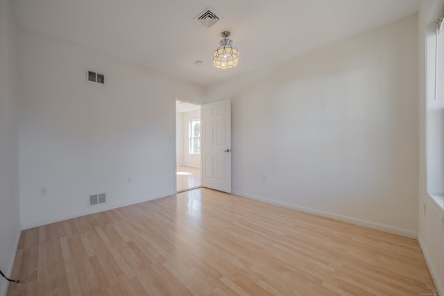 spare room featuring light hardwood / wood-style flooring