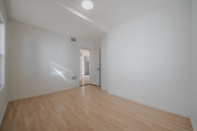 unfurnished room featuring light hardwood / wood-style flooring