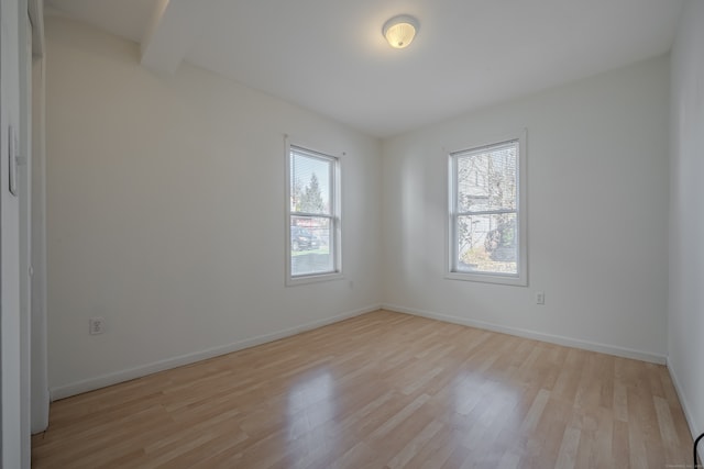 unfurnished room featuring light hardwood / wood-style flooring