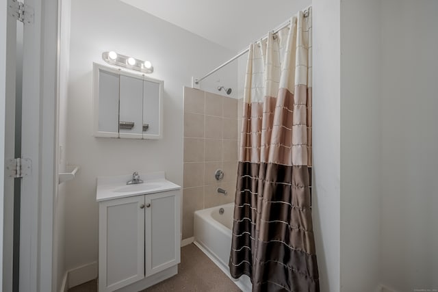 bathroom with shower / bath combo with shower curtain and vanity