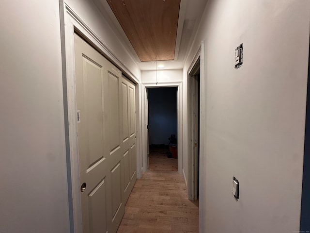 hallway with wooden ceiling and light hardwood / wood-style floors