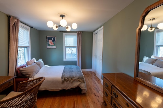 bedroom with a closet and light hardwood / wood-style flooring