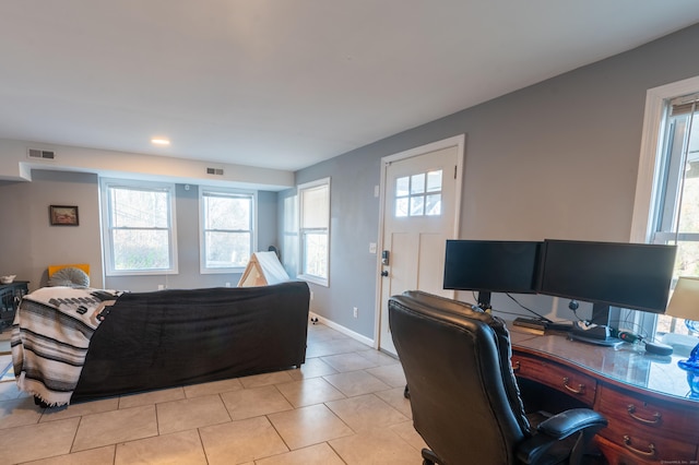 tiled bedroom featuring multiple windows