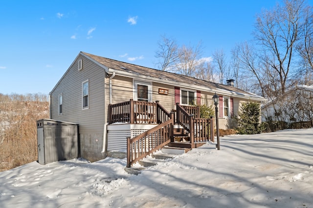 view of front of house with a wooden deck