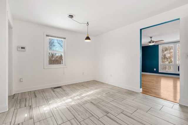 unfurnished dining area featuring plenty of natural light