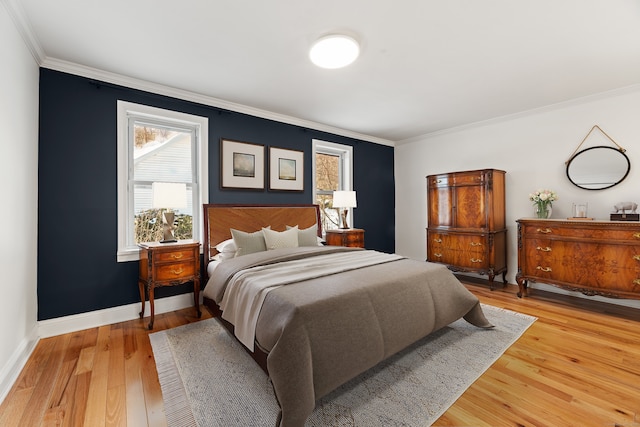 bedroom with crown molding and hardwood / wood-style floors