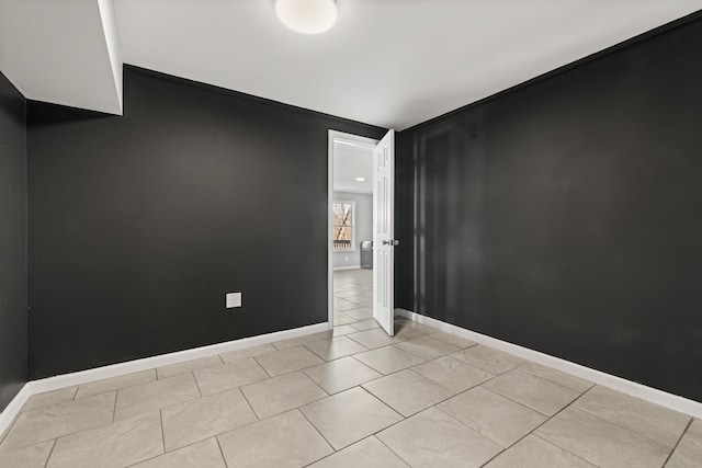 empty room featuring light tile patterned flooring