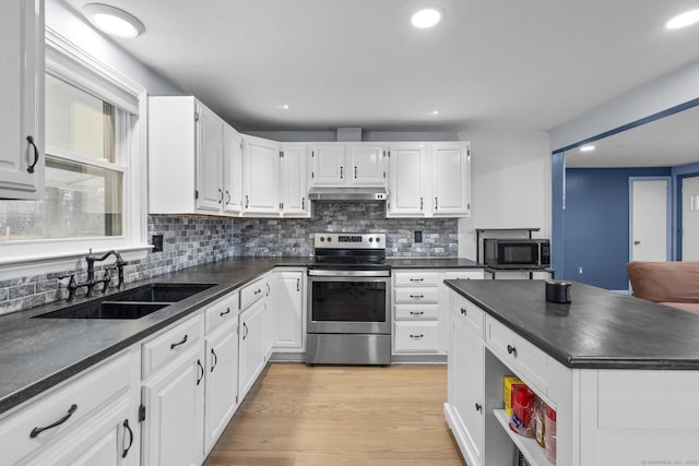 kitchen featuring white cabinetry, appliances with stainless steel finishes, sink, and light hardwood / wood-style floors