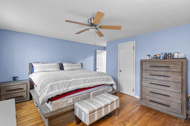 bedroom featuring hardwood / wood-style flooring and ceiling fan