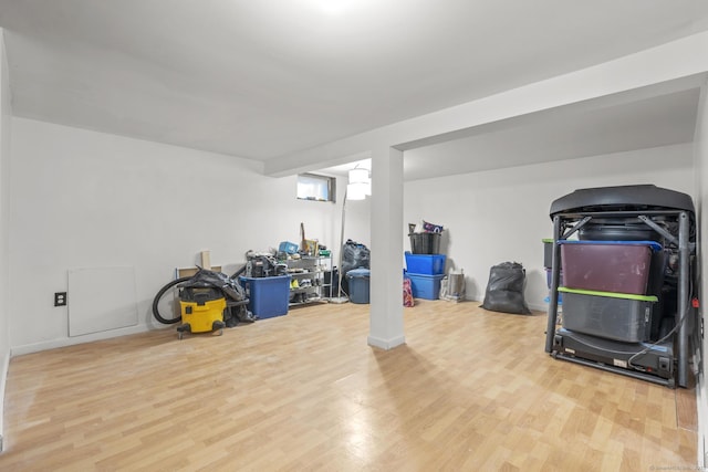 basement with hardwood / wood-style flooring