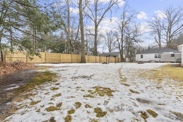 view of yard layered in snow