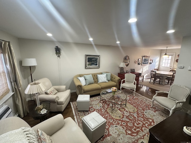 living room with wood finished floors and recessed lighting