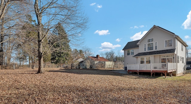 back of property with a deck