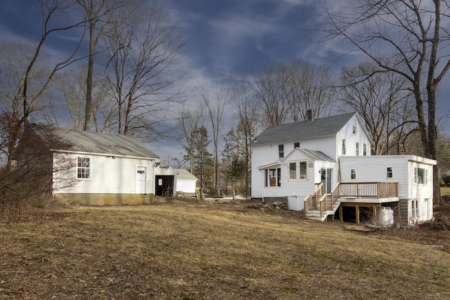 back of property featuring a deck