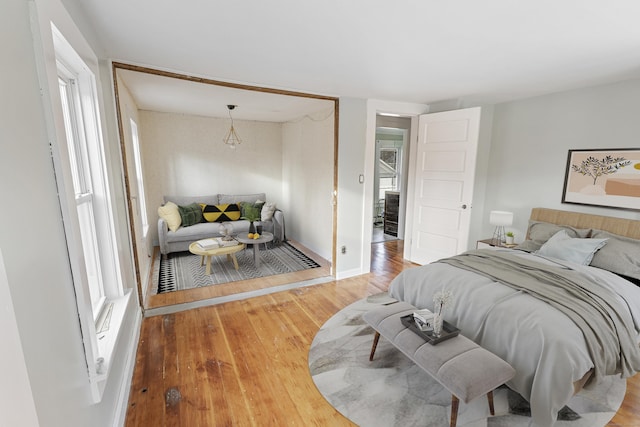 bedroom with wood-type flooring