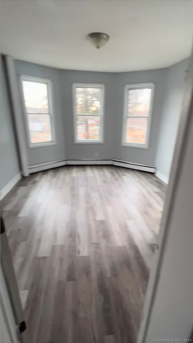 spare room featuring hardwood / wood-style flooring