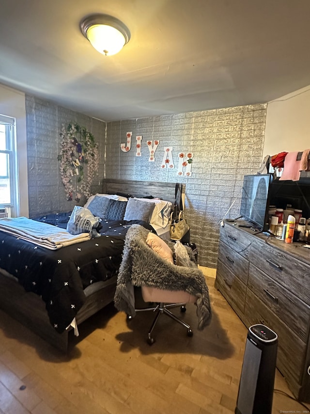 bedroom featuring wood-type flooring